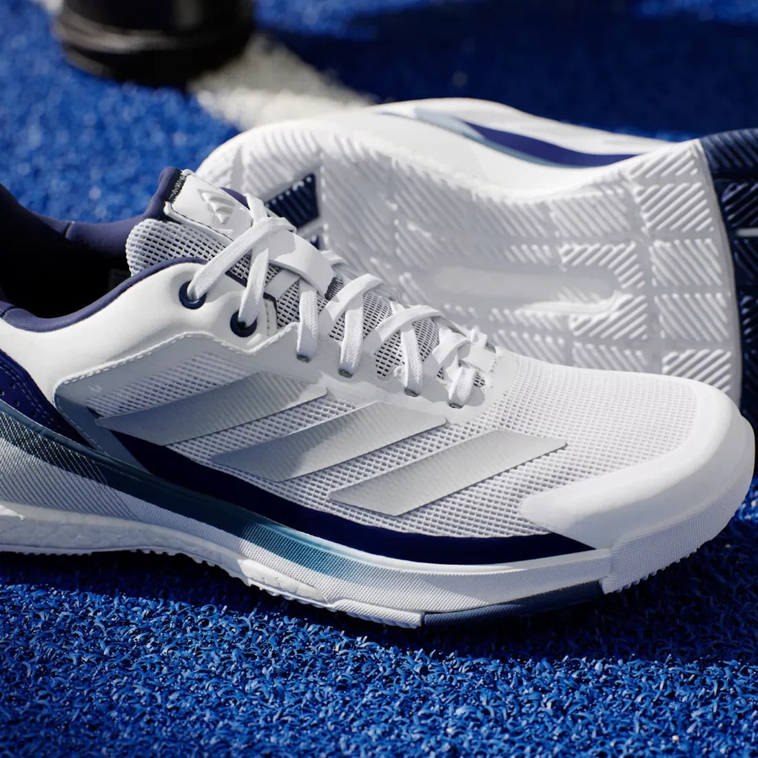 Adidas Crazyquick Boost men's padel shoes (White/Dark Blue) - close-up of the upper and toe, sole of the other shoe behind