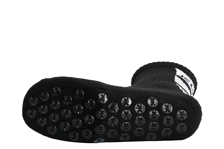 Kupe Calf Length Kids Black padel socks - underside view of the textured grip sole