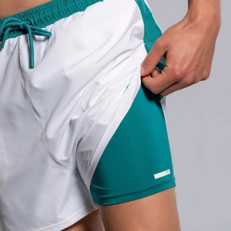 2026 Nox Pro men's padel shorts (White/Ivy Green) - hem lifted to show the mesh inner short