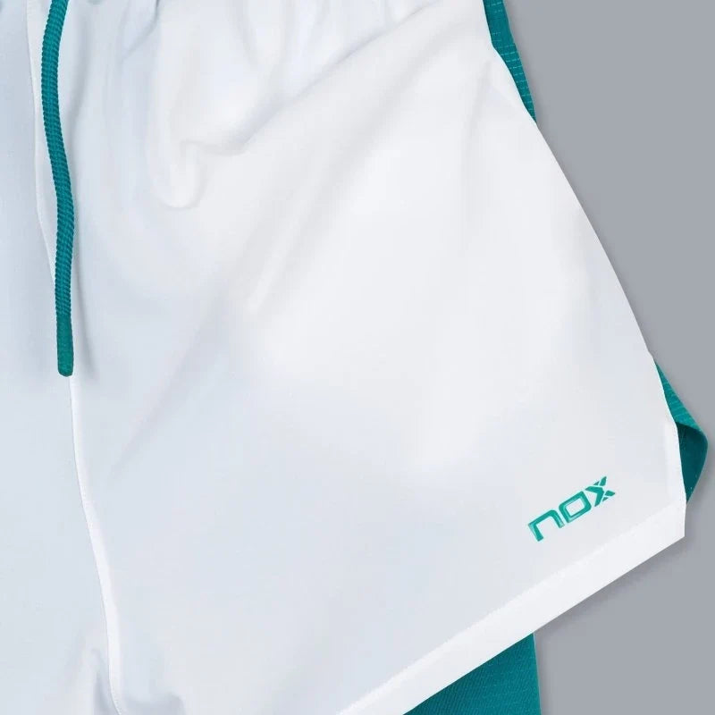 2026 Nox Pro men's padel shorts (White/Ivy Green) - hem and logo detail
