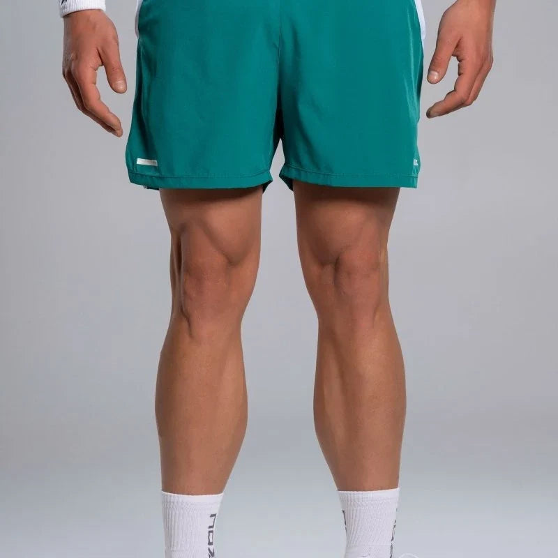 2026 Nox Pro men's padel shorts (Ivy Green) - front view on model
