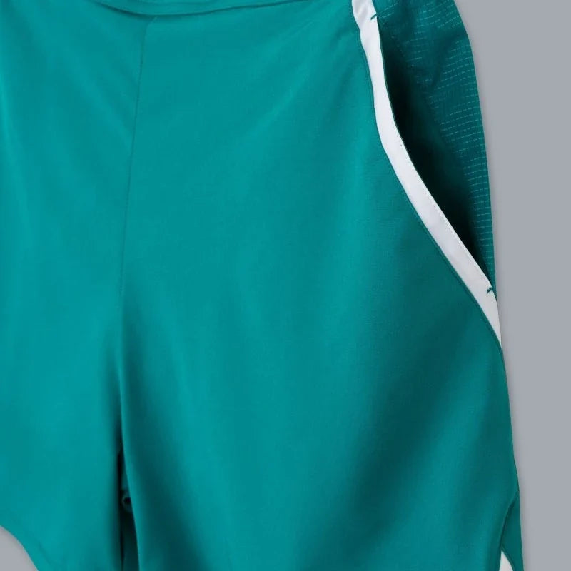 2026 Nox Pro men's padel shorts (Ivy Green) - side pocket and piping detail