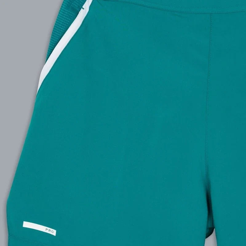 2026 Nox Pro men's padel shorts (Ivy Green) - side panel and hem tab detail